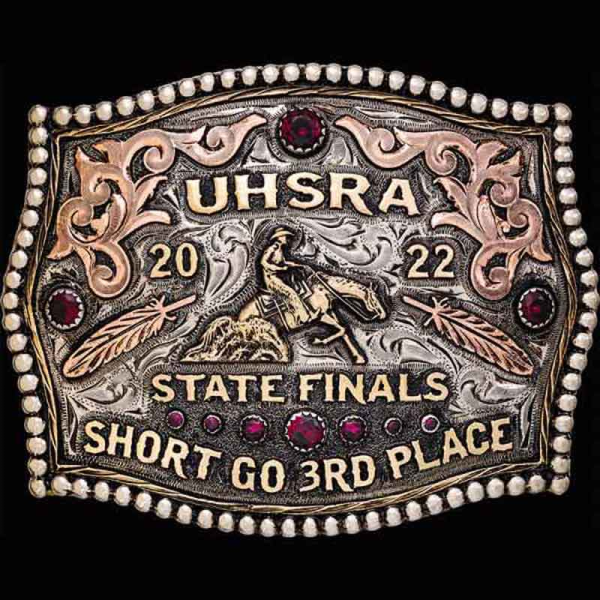 The Richfield Custom Belt Buckle features a silver bead edge with copper scrollwork and 2D feathers. Customize this buckle for your rodeo event today!